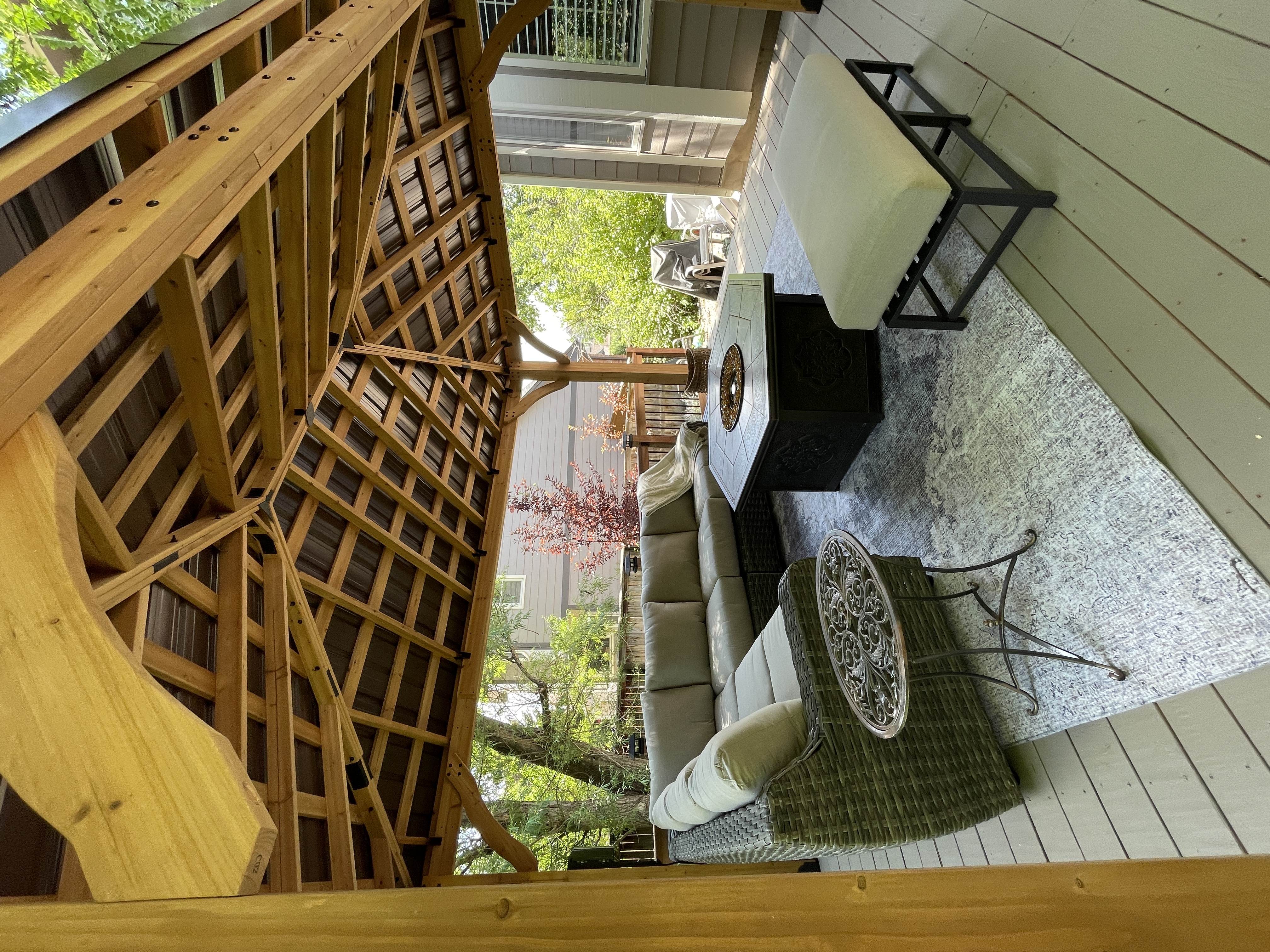 Luxury pergola with outdoor furniture and fire feature